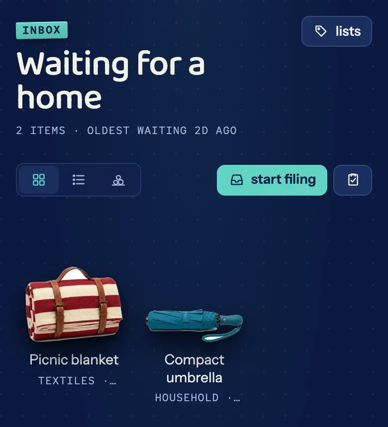 The Inbox, titled "Waiting for a home", holding a picnic blanket and a compact umbrella above a "start filing" button.