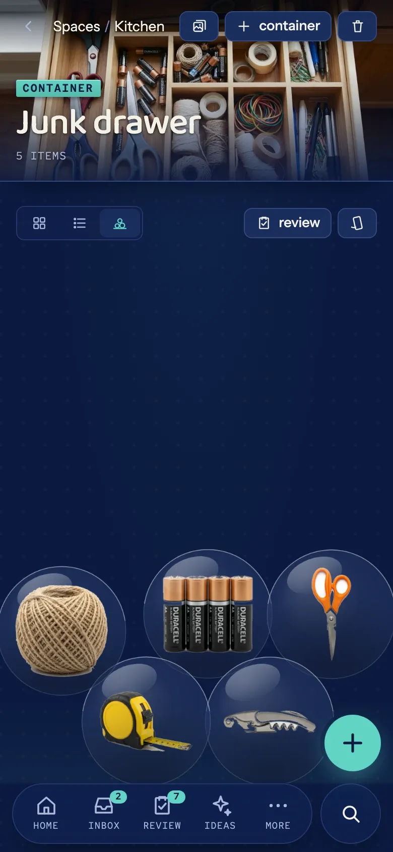 The pile view: five junk-drawer things rendered as draggable bubbles heaped at the bottom of the screen.